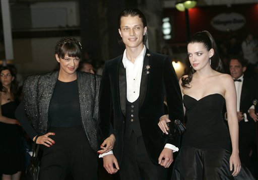 From left, actress Asia Argento, actor Fu'ad Ait Aattou, and actress Roxanne Mesquida arrive for the screening of the film Une Vieille Maitresse, at the 60th International film festival in Cannes.