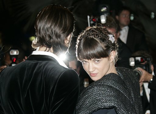 Actor Fu'Ad Ait Aattou, left, and Italian actress Asia Argento arrives for the screening of the film Une Vieille Maitresse, at the 60th International film festival in Cannes.