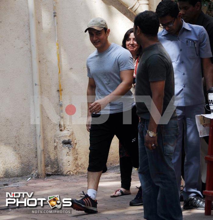 Birthday Boy Aamir is all smiles as he arrives to greet fans and the waiting media.