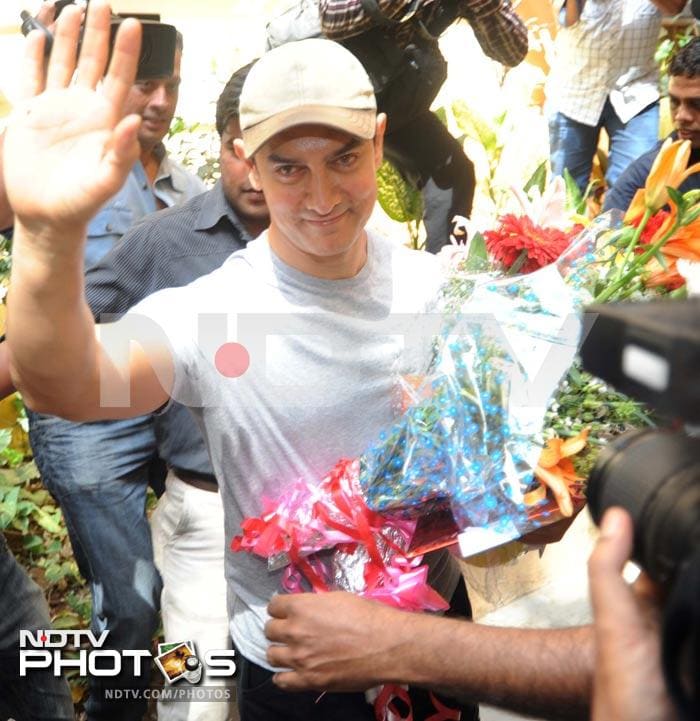 Aamir waves to fans.