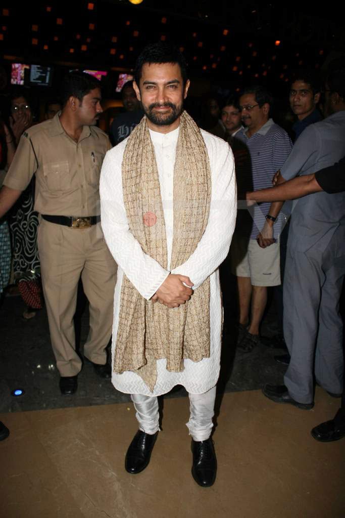 Dressed to be a patriot, Aamir can't help smiling.