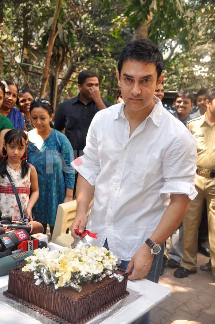 Aamir Khan gets ready to cut his birthday cake.