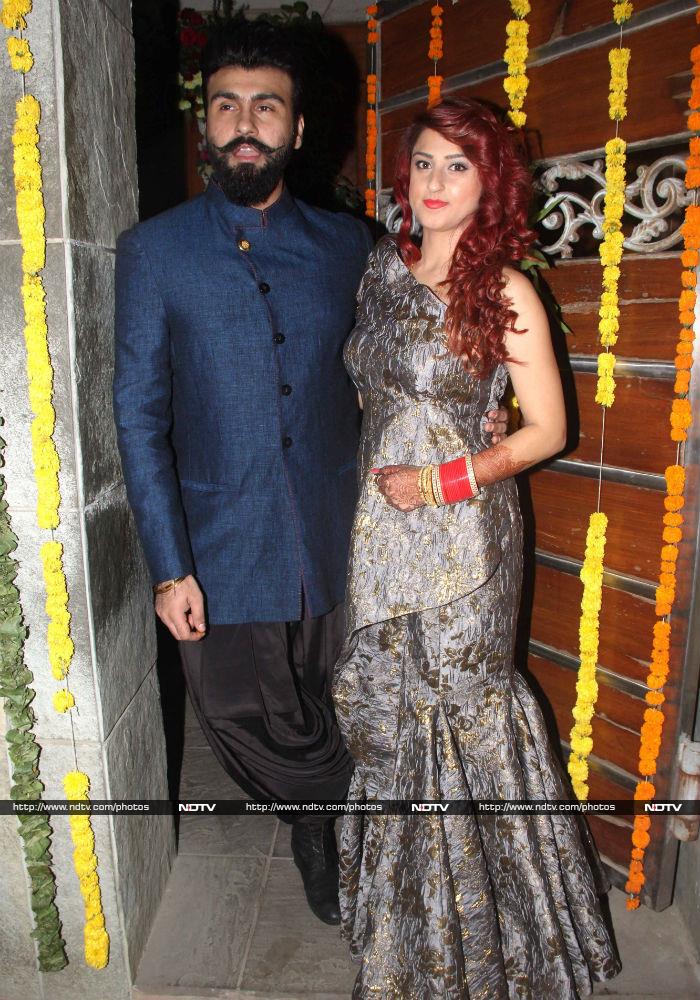 Actor Arya Babbar made a short public appearance with his wife Jasmine Puri at his Mumbai residence on February 22, soon after they got married at a <i>gurudwara</i> in the city. Aarya's outfit comprised a <i>pathani salwar</i> and <i>sherwani</i> jacket, while Jasmine looked pretty in a fish cut dress.