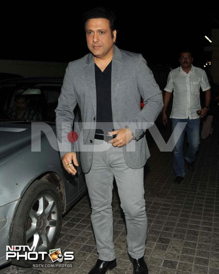 Govinda looked dapper in a grey coat teamed with a black shirt.