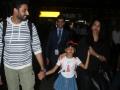 Abhishek, Aishwarya and Aaradhya Touch Down In Mumbai cover_800.jpg