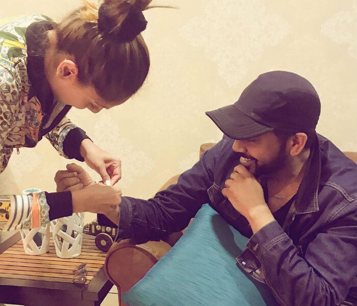 Bipasha Basu tied a Rakhi to designer Rock S. <br><br> This image was posted on Instagram by <a href="https://www.instagram.com/p/BXeqjSSHzUh/?hl=en&taken-by=bipashabasu" target="_blank" rel="nofollow" >Bipasha Basu </a>