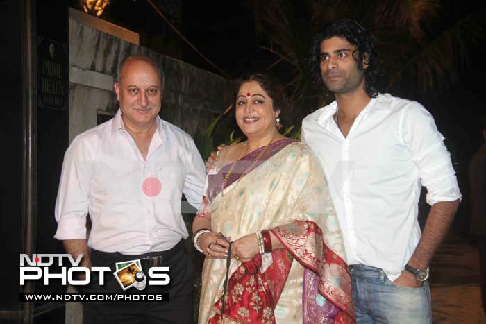 Wife Kirron and son Sikander Kher accompany Anupam Kher.