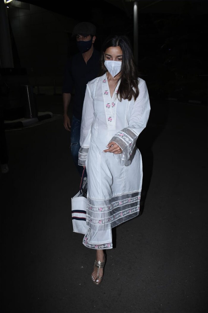 Alia Bhatt picked a white outfit for the flight.