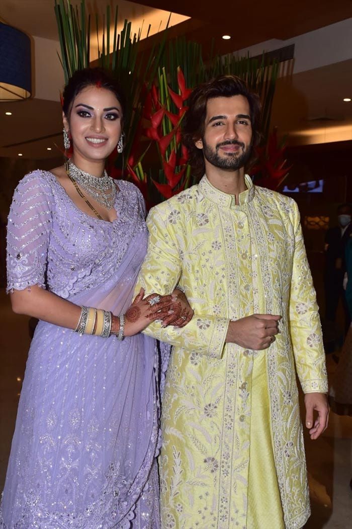 Newlyweds Anushka Ranjan and Aditya Seal stepped out to pose for the paparazzi - she looked gorgeous in a lavender <I>lehenga</i> by Manish Malhotra while Aditya Seal was looking dashing in a pastel yellow <I>sherwani</i>. (Image courtesy: Varinder Chawla)