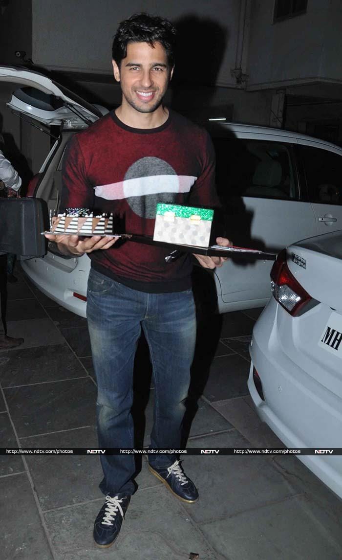 Sidharth smiled from ear-to-ear as he posed with gifts from his fans.