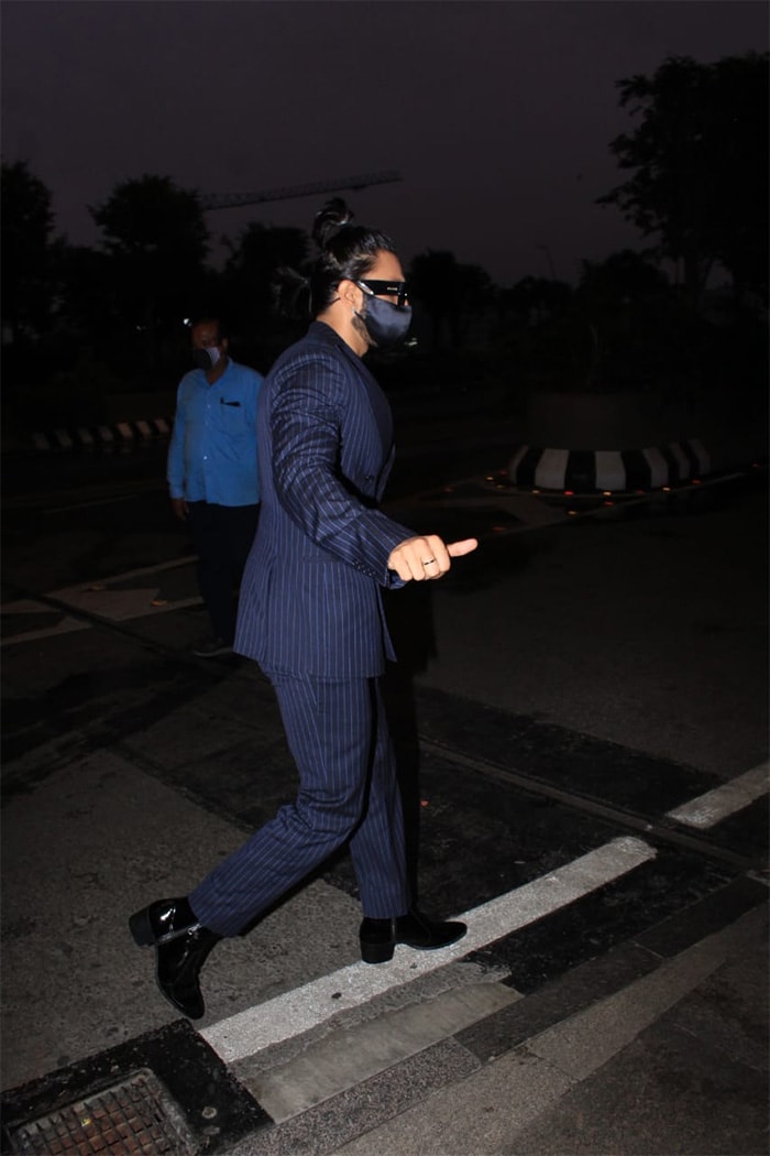 Ranveer Singh styled his suited look with a double-ponytail hairdo because only Ranveer Singh can.