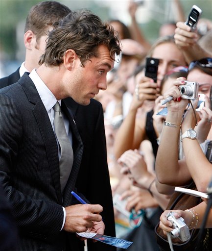 Jude Law signs autographs before a screening of All The King's Men at McAlister Auditorium at Tulane University in New Orleans.