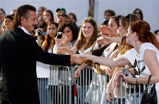 Sean Penn shakes hands with fans at a screening of All The King's Men at McAlister Auditorium at Tulane University in New Orleans.