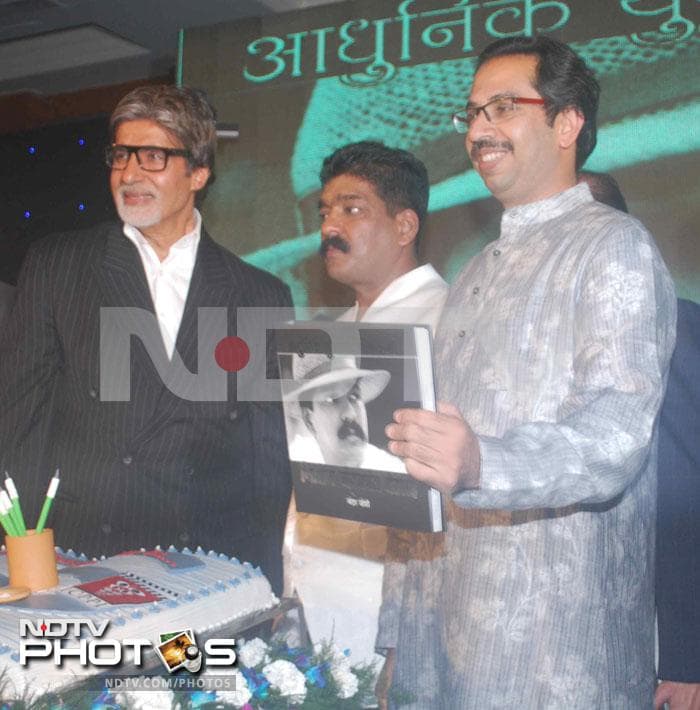 The Executive President of Shiv Sena, Uddhav Thackeray, who was special guest at the event, unveils the book on legendary art director Nitin Chandrakant Desai with Amitabh Bachchan.