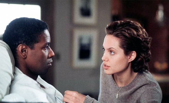 In <i>Bone Collector</> (1999), Jolie played Amelia Donaghy, a reluctant police officer who is called in to assist veteran detective Lincoln Rhyme (Denzel Washington). Together, the odd pair, one paralysed from the neck down and the other haunted by her cop father's suicide, together track down a serial killer.