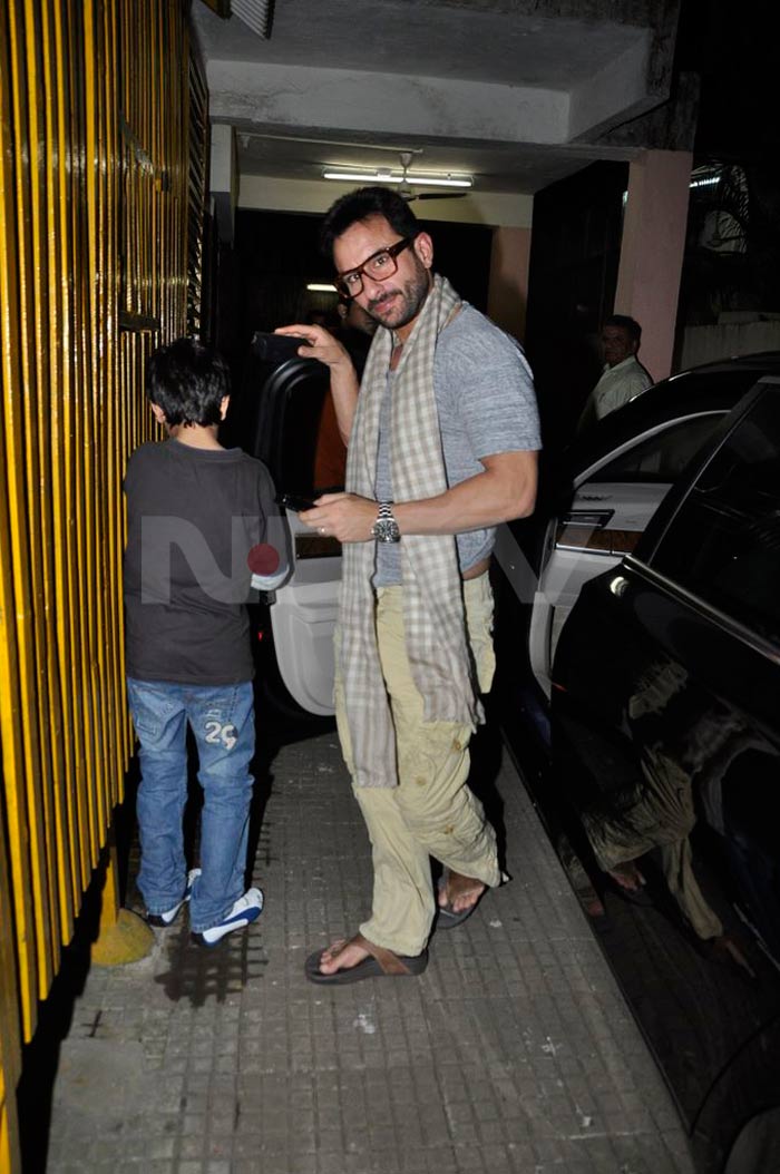 Bollywood superstar Saif Ali Khan arrives at the venue dressed casually and sporting professor glasses. Also seen in the picture is son Ibrahim.