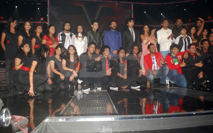 The contestants pose with their judges.