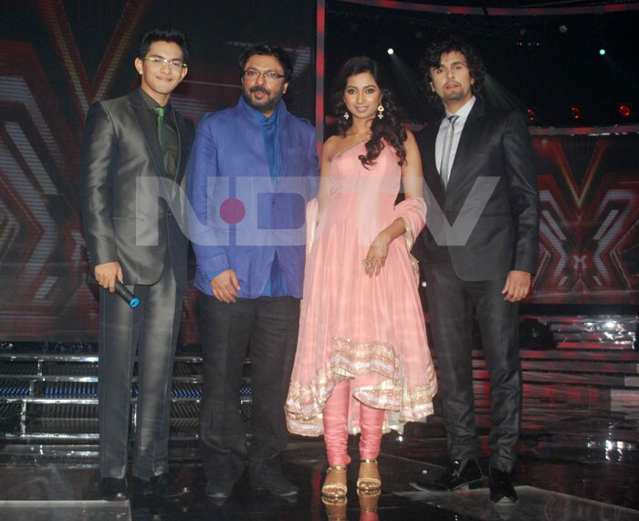 The four judges: Aditya Narayan, Sanjay Leela Bhansali, Shreya Ghoshal and Sonu Nigam pose for the cameras at the <i>X Factor</i> press conference.