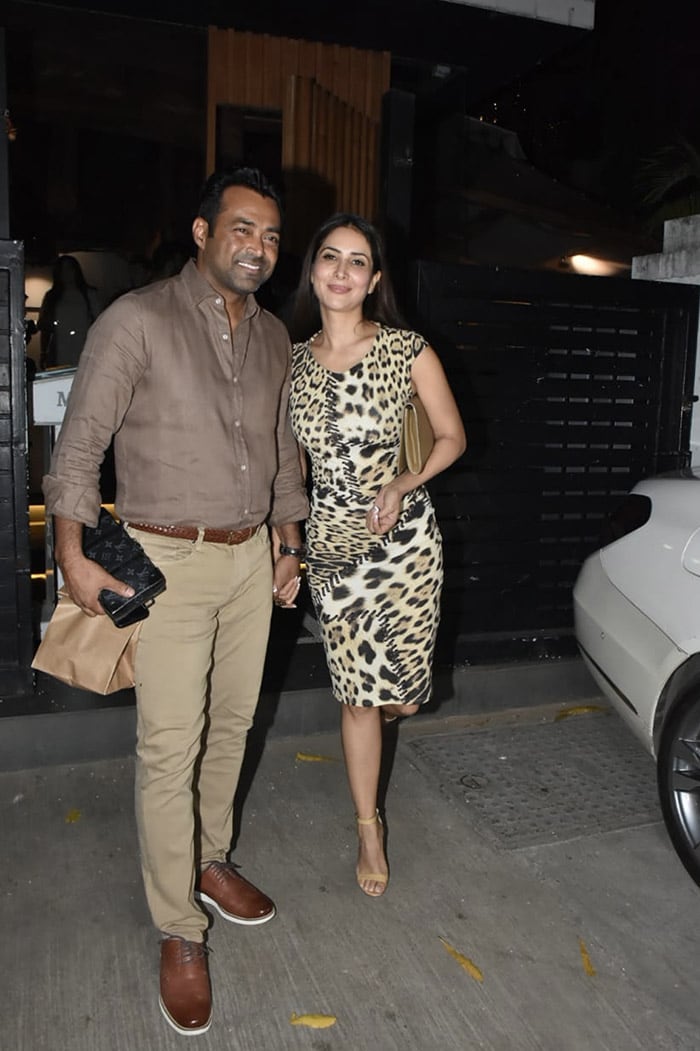 Kim Sharma and Leander Paes posed for shutterbugs at Mizu in Bandra.