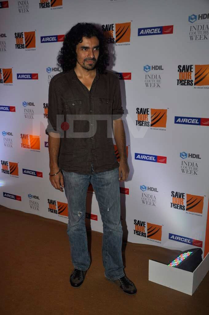 Director Imtiaz Ali walks in to attend Manish's show.