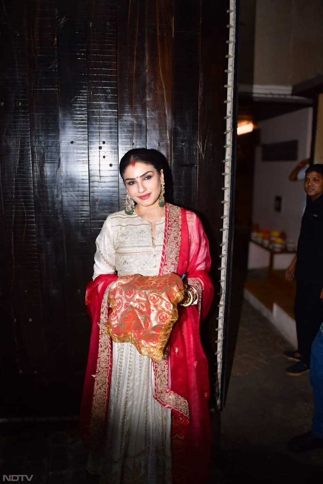 Raveena Tandon wore a red and white Anarkali suit with exquisite work on it. (Image Courtesy: Varinder Chawla)