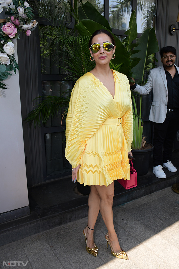 Malaika Arora looked stunning in a yellow shirt dress. (Image Courtesy: Varinder Chawla)