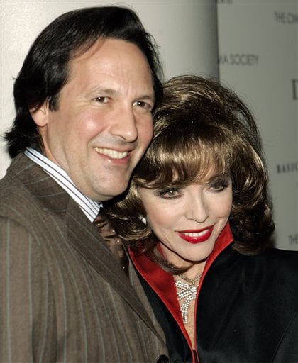 Joan Collins and her fifth husband Percy Gibson pose for photographers during arrivals at the world premiere of the thriller film Basic Instinct 2. (AP)