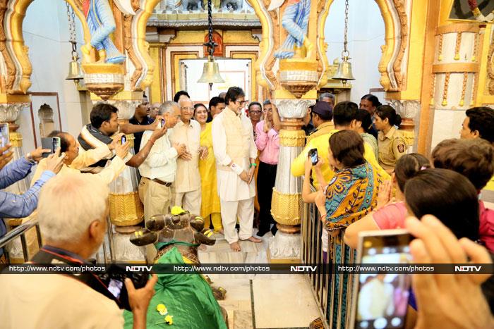 Big B, who wore a Nehru Jacket over a white Kurta, was swamped by fans who clamoured for a glimpse of him.