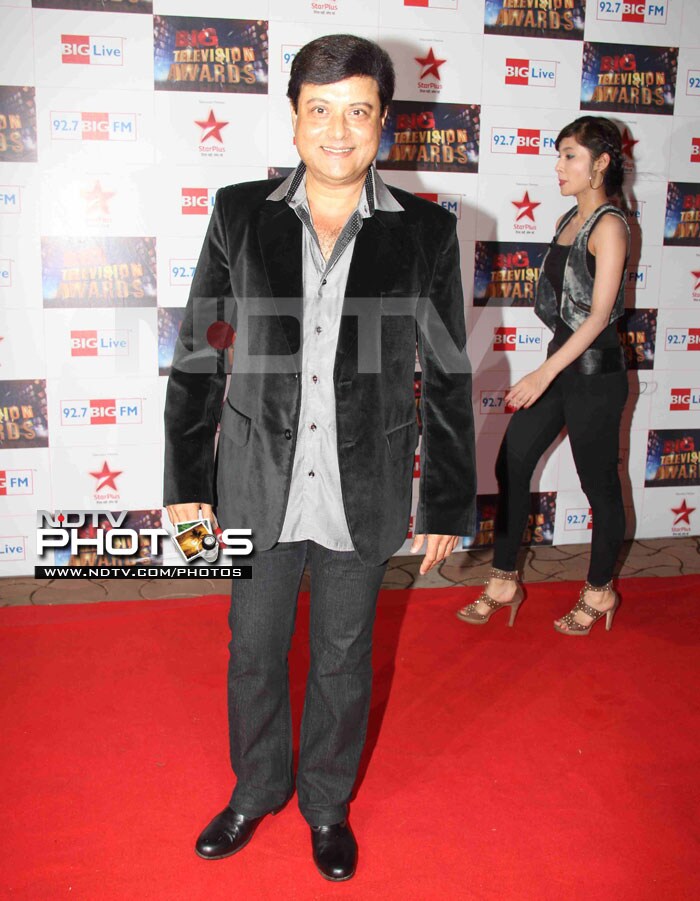 Always with a smile - Sachin Pilgaonkar walks the carpet.