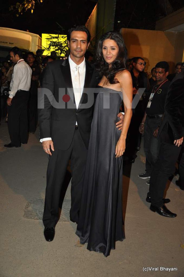 Arjun Rampal's wife Mehr Jessia wears a flowing black gown.