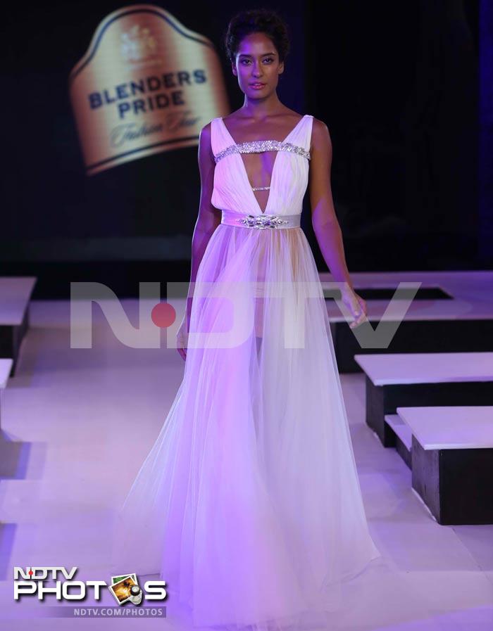 Lisa Haydon's white and silver Grecian style dress sets off her dusky skin.