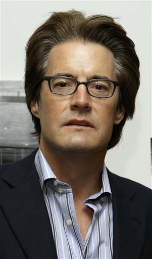 Kyle MacLachlan poses for photographers as he arrives at the Museum of Modern Art in New York for a special screening of the new film Blood Diamond.