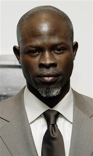 Djimon Hounsou poses for photographers as he arrives at the Museum of Modern Art in New York for a special screening of his new film titled Blood Diamond.