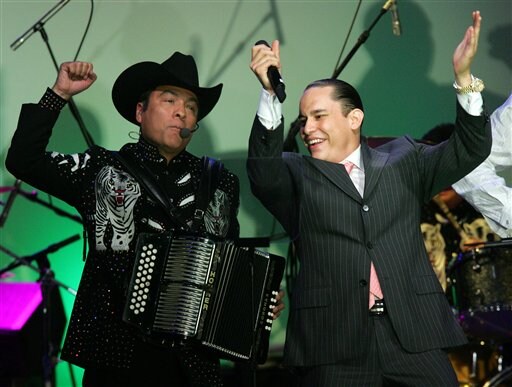 Los Tigres del Norte's Jorge Hernandez, left, performs with Mariano Barba at BMI's 14th annual Latin Music Awards.