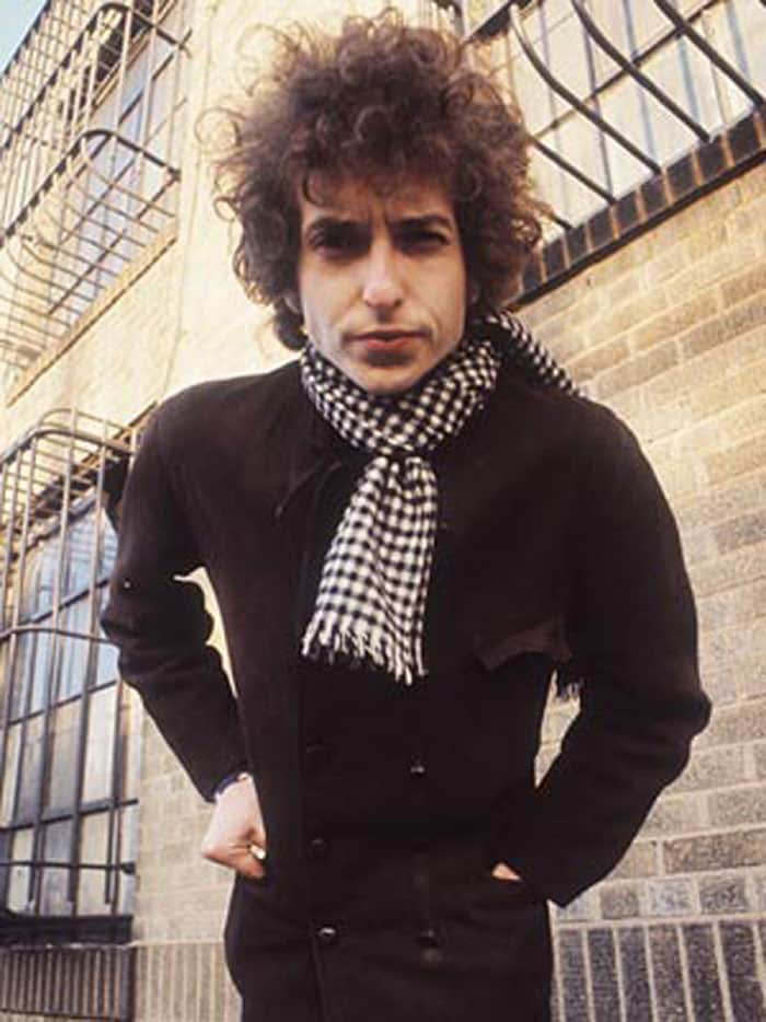 In the latter half of 1964 and 1965 Bob Dylan made rapid changes in his musical style and his appearance.  He was now a folk-rock pop-music star.  The scruffy jeans and work shirts were replaced by a formal wardrobe and sunglasses, day and night.