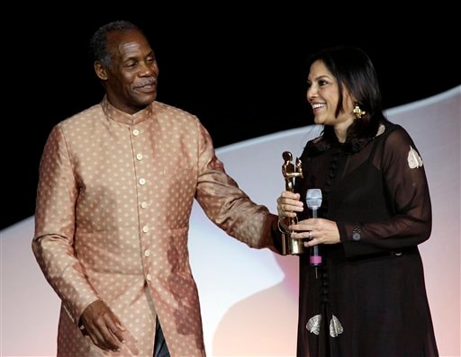 American actor Danny Glover presents Indian film producer and director Mira Nair the Pride of India award at the 9th annual Bollywood Movie Awards in Uniondale, NY.