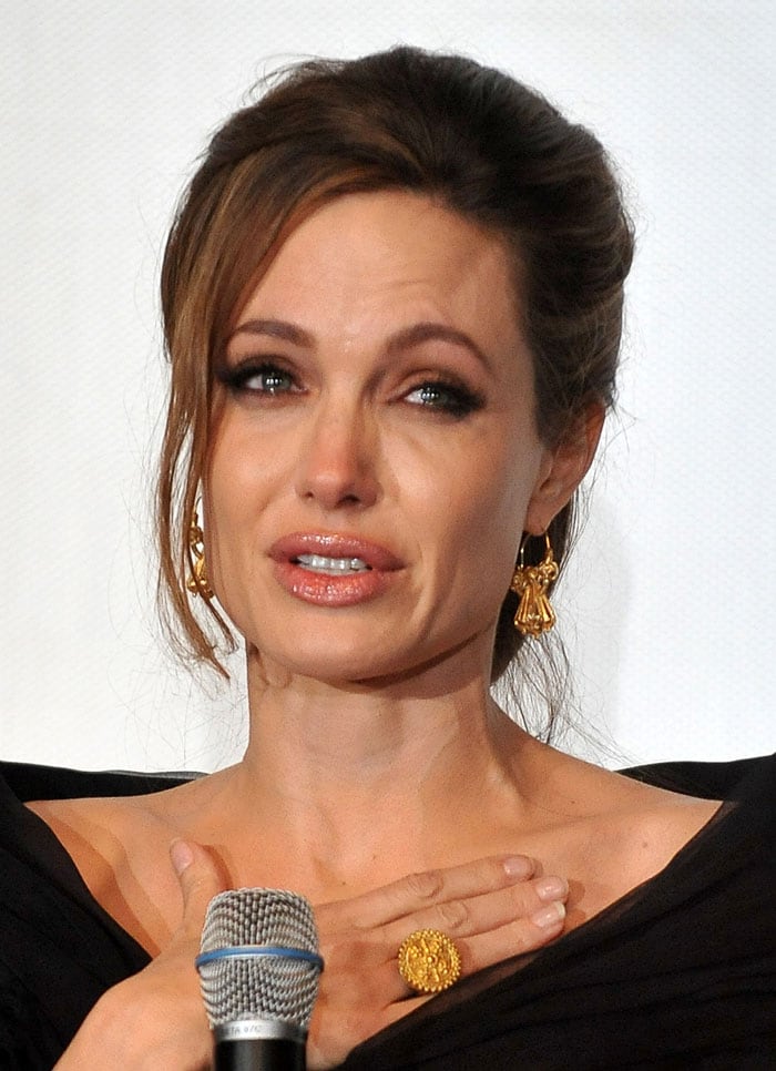 Much in love Jolie, Pitt promote new film together