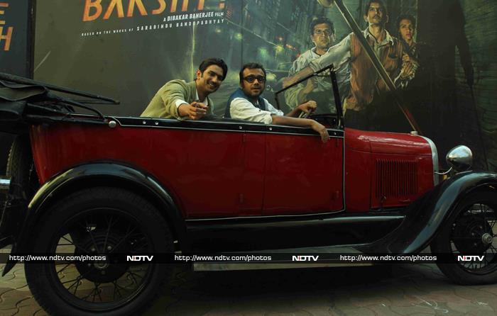 Sushant posed with director Dibakar in a red vintage car.