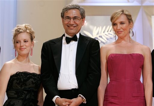 Jury members, left to right, Canadian actress Sarah Polley, Turkish novelist Orhan Pamuk, and Australian actress Toni Collette appear on stage during the opening.