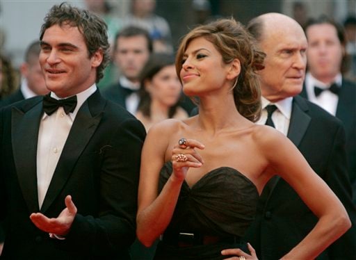 From left, American actors Joaquin Phoenix, Eva Mendes and Robert Duvall arrive for the screening of the film We Own the Night, at the 60th International film festival in Cannes, southern France.