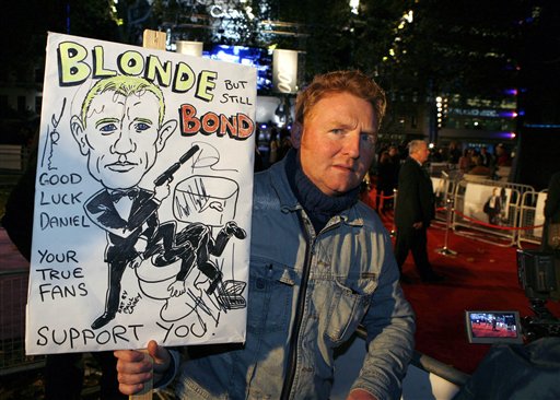 A James Bond movies fan, name not given, holds a placard, prior to the world premiere of the new James Bond film Casino Royale at a cinema in central London's Leicester Square.