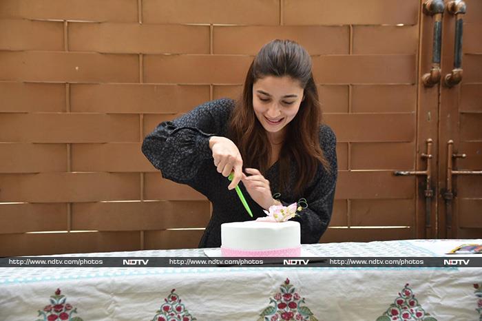 Birthday girl Alia Bhatt was photographed cutting the cake in Mumbai.