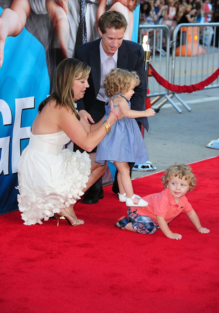 <i>The Change-Up</i> castmember Luke Bain (below right), who plays the role of Peter, crawls on the red carpet.<br><br>
His parents Missy and Matthew Bain pick up his twin sister Lauren, who also stars in the movie, as they attend the premiere of <i>The Change-Up</i> at the Village Theatre.