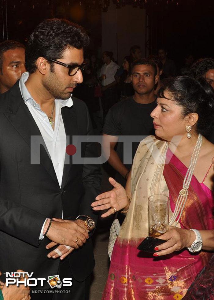 Abhishek looks engrossed in a serious discussion with Kiran Juneja Sippy.