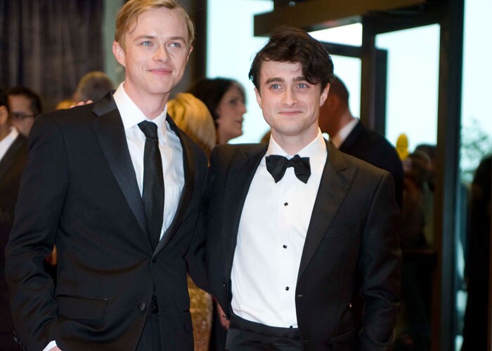 Handsome hunks - Daniel Radcliffe, minus the wand and robe, and Dane DeHaan.