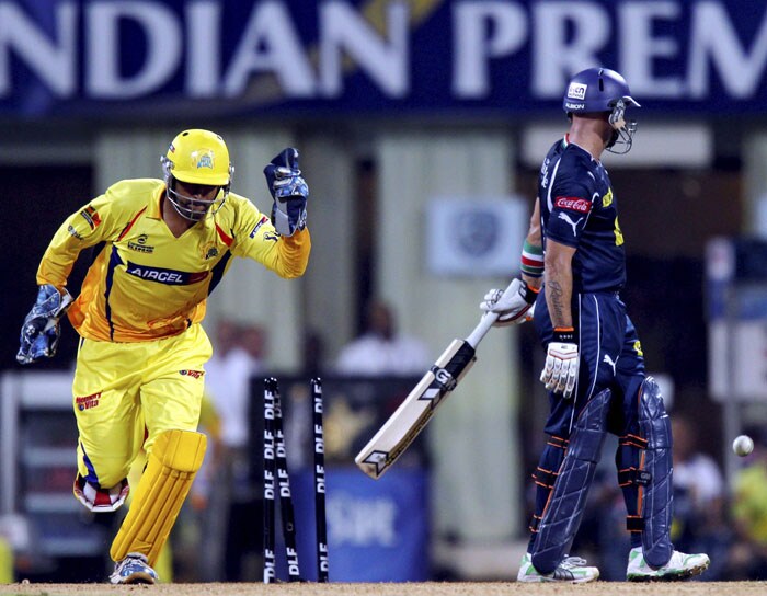 Chennai Super Kings skipper MS Dhoni celebrates the wicket of Deccan Chargers' Herschelle Gibbs, cleaned bowled by Shadab Jakati, during the IPL second semi-final match at D Y Patil Stadium in Navi Mumbai. (PTI Photo)