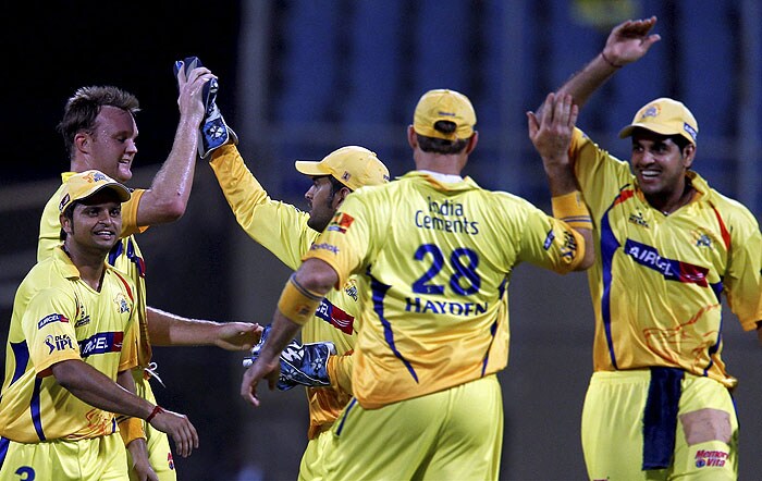 Chennai Super Kings' players celebrate the wicket of Deccan Chargers skipper Adam Gilchrist during the IPL second semi-final match at D Y Patil Stadium in Navi Mumbai. (PTI Photo)