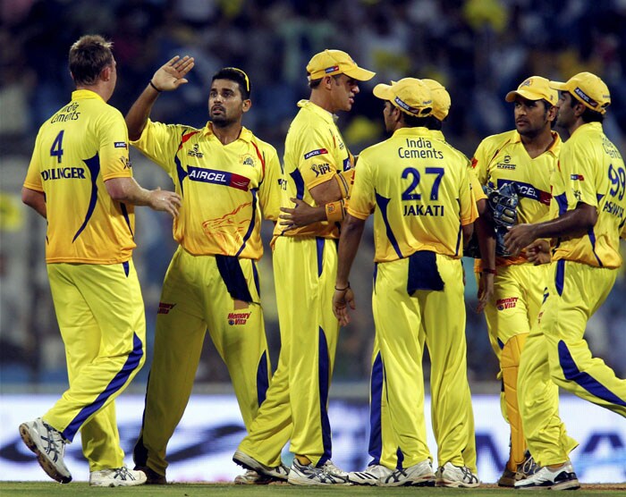 Chennai Super Kings' players celebrate the wicket of Deccan Chargers' skipper Adam Gilchrist during their IPL second semi-final match at D Y Patil Stadium in Navi Mumbai. (PTI Photo)