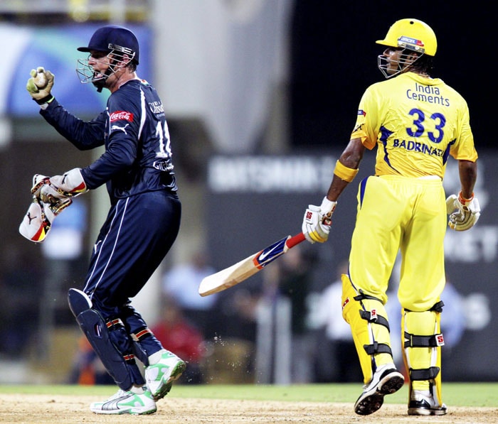 Deccan Chargers skipper Adam Gilchrist exults after the dismissal of Chennai Super Kings' S Badrinath during their IPL second semi-final match at D Y Patil Stadium in Navi Mumbai. (PTI Photo)