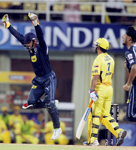 Deccan Chargers skipper Adam Gilchrist jumps to celebrate the dismissal of Chennai Super Kings captain M S Dhoni during their IPL second semi-final match at D Y Patil Stadium in Navi Mumbai. (PTI Photo)